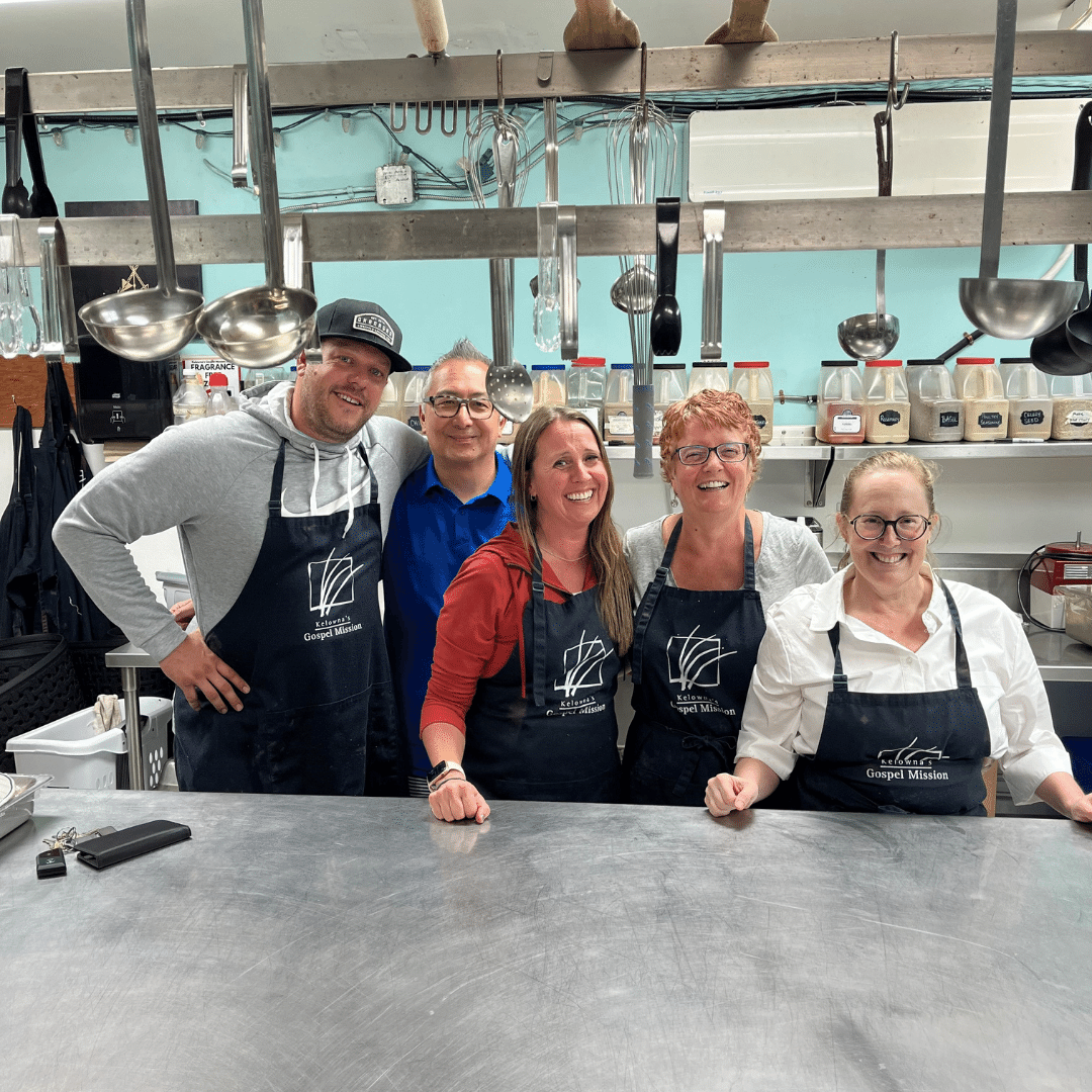 The WMB Kelowna team serves meals (and smiles) at the Gospel Mission.